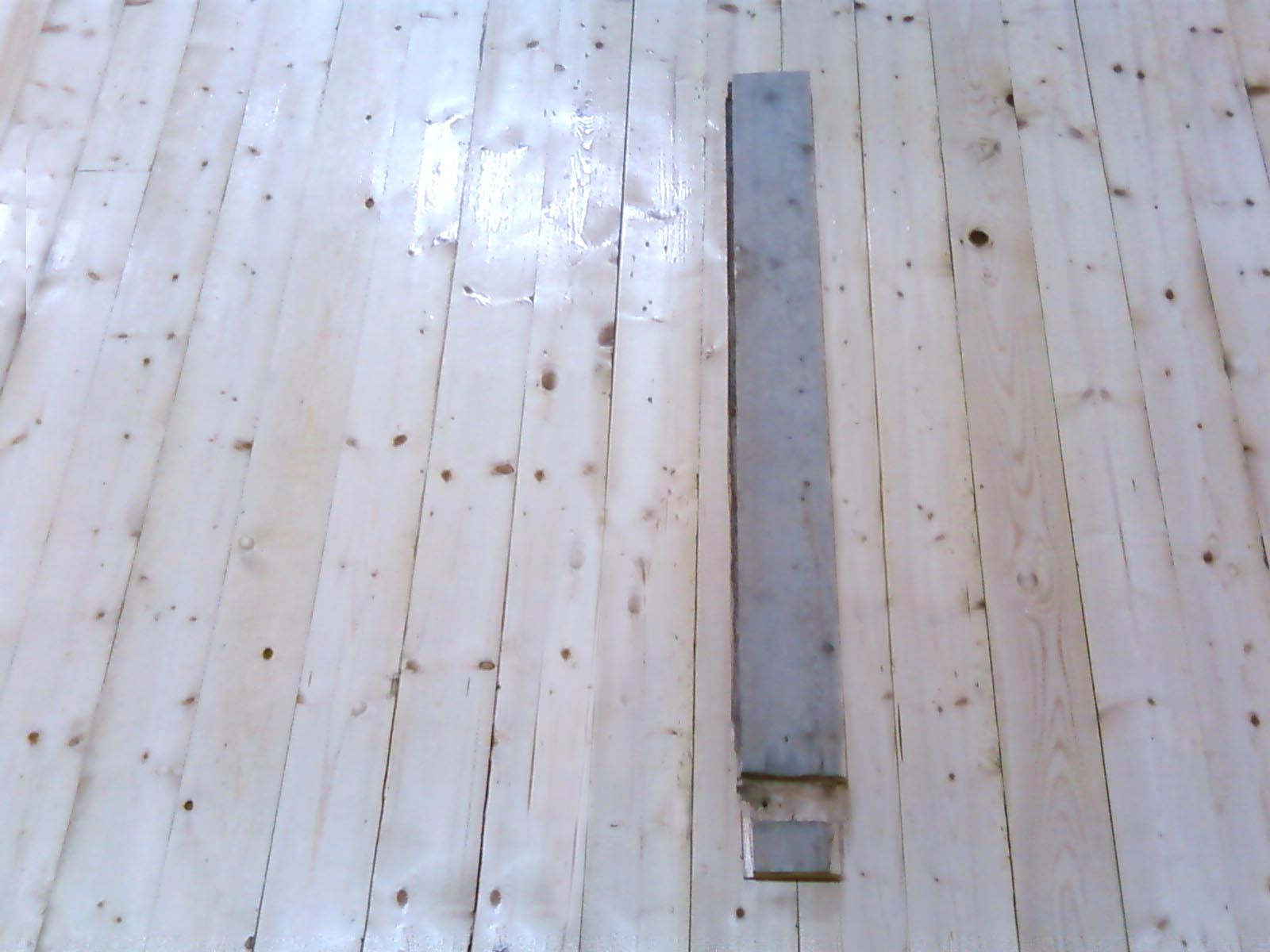 Finished floor with an original piece of floor placed on top.